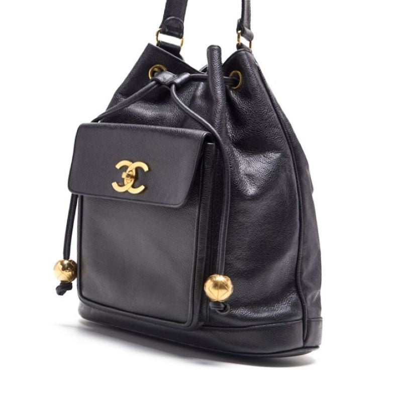 Pre-Owned Chain Backpack Bag, Outside Flap with Ball Charm, Drawstring, Caviar Skin, Black, Gold-Tone Hardware, Pre-Owned