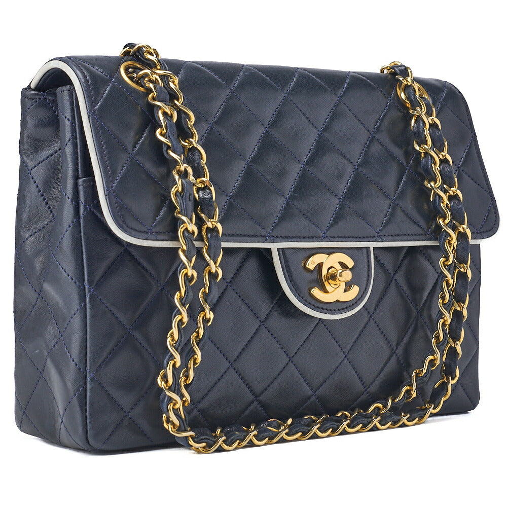 Sac fourre-tout d'occasion en cuir d'agneau matelassé bicolore bleu marine et finitions dorées.