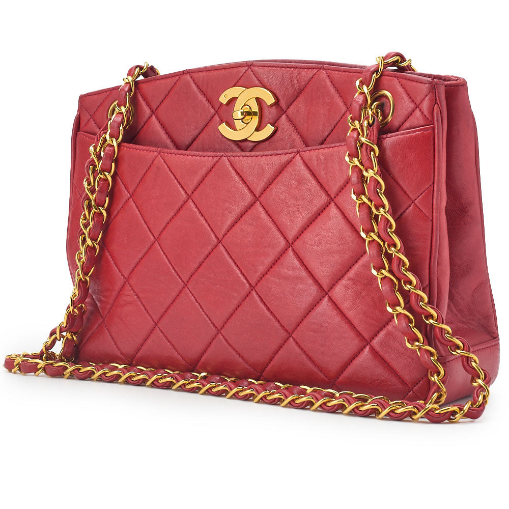 Sac bandoulière d'occasion Matelasse Deca Coco, fermoir tournant, cuir d'agneau rouge, quincaillerie dorée. D'occasion