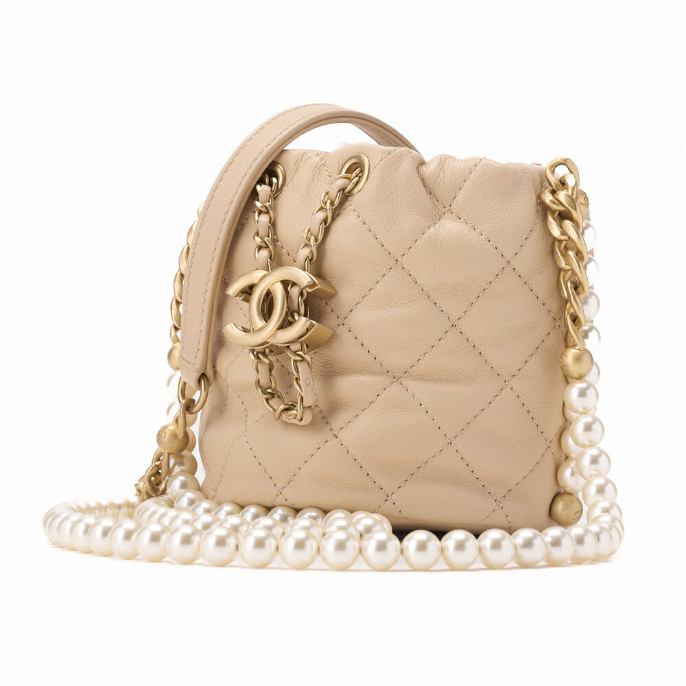 Sac bandoulière d'occasion, matelassé, cuir d'agneau, beige, finitions dorées, avec cordon de serrage