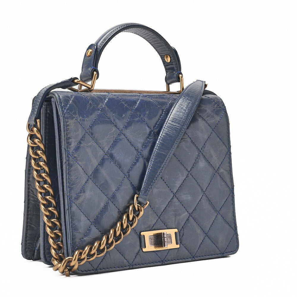 Sac à bandoulière matelassé 2 voies d'occasion en cuir de veau vintage bleu marine, matériel doré.