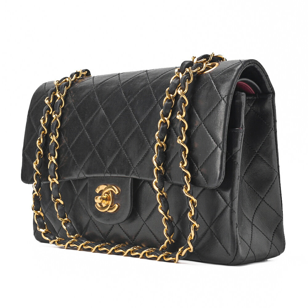 Sac bandoulière chaîne matelassé à double rabat en cuir d'agneau noir et métal doré d'occasion