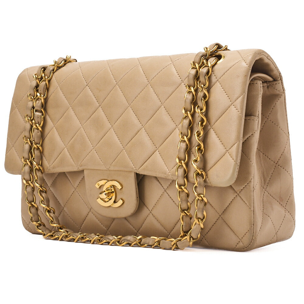 Sac bandoulière chaîne d'occasion en cuir d'agneau matelassé beige et accessoires dorés.