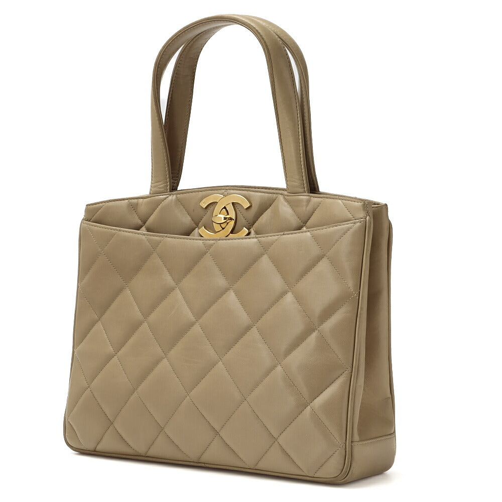Gebrauchte Handtasche Matelassé Drehverschluss Lammleder Beige Goldfarbene Hardware Gebraucht